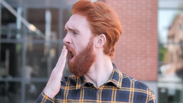 Outdoor Yawning Redhead Beard Young Man