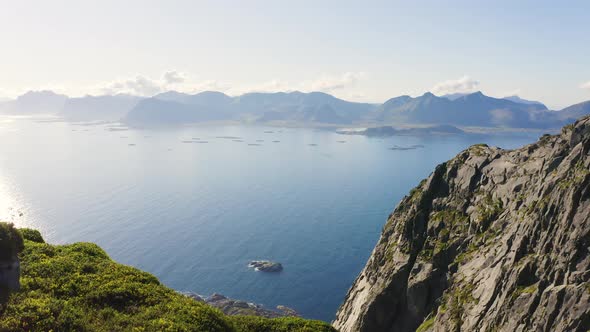 Flying Around a Hiker on Top of Mount Festvagtind on Lofoten Islands Norway