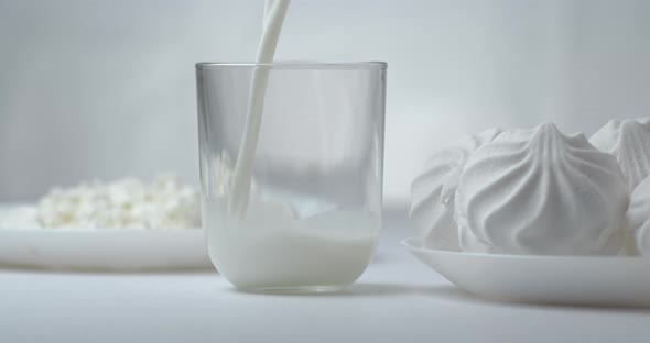 Filling Glass with Milk Close Up