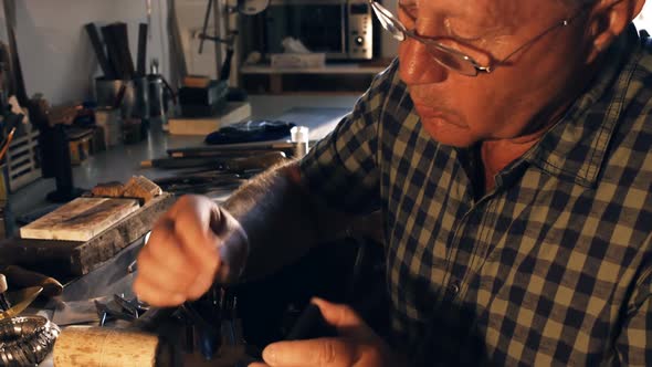 Goldsmith preparing ring