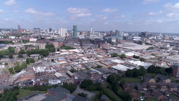 Rise up aerial shot over Birmingham city centre on a bright day