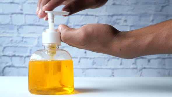 Close Up Young Man Hand Using Sanitizer Gel Preventing Virus