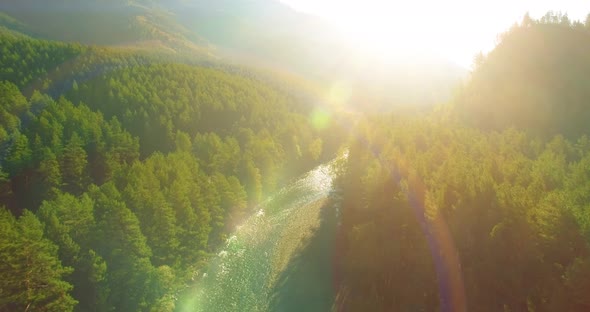 Low Altitude Flight Over Fresh Fast Mountain River with Rocks at Sunny Summer Morning