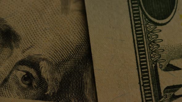 Rotating footage shot of American paper currency on an American eagle shield background 