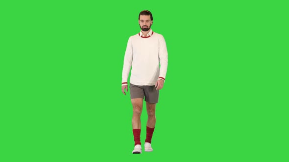 Handsome Male Tennis Player Walking on a Green Screen Chroma Key