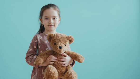 Adorable Little Girl with Plush Toy