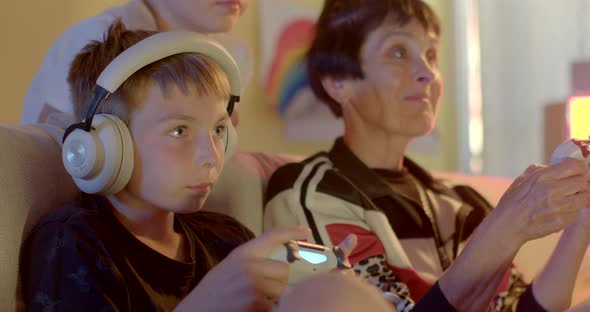 Boy Playing Video Game Using Controller Demonstrates Emotions Experience Story