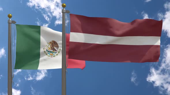 Mexico Flag Vs Latvia Flag On Flagpole