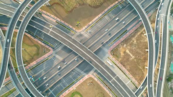 Top View To the Cars Driving on Multi-level Highway on the Sunset. Highway Multilevel Junction Road