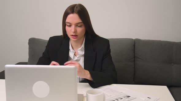 Focused Young Businesswoman Has Video Calling for Remote Job Interview Using Laptop Webcam