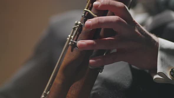 Musician is Playing Wind Instrument Closeup View of Hands on Bassoon Bassoonist is Playing Solo