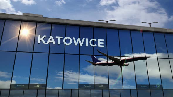 Airplane landing at Katowice Poland airport mirrored in terminal