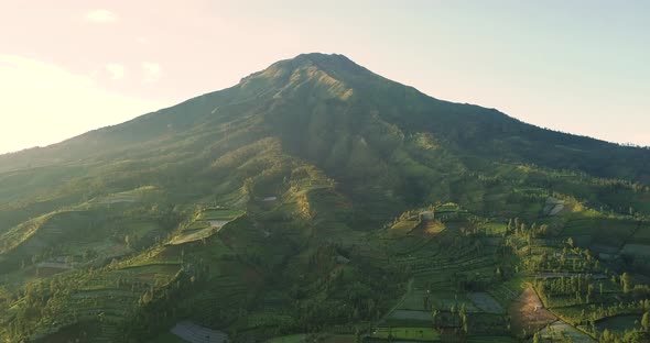 mount sumbing with rural view countryside. lush trees in plantations. beauty scene of landscape in W