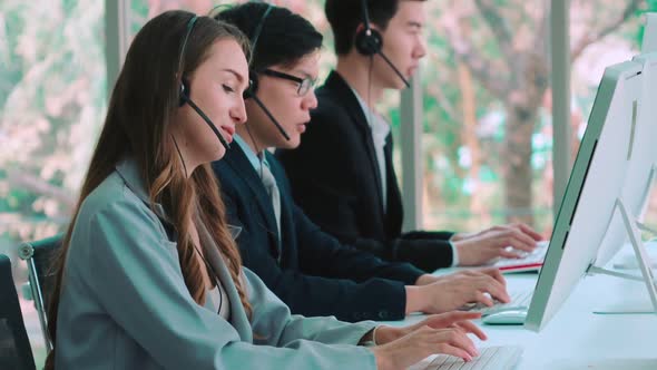 Business People Wearing Headset Working in Office