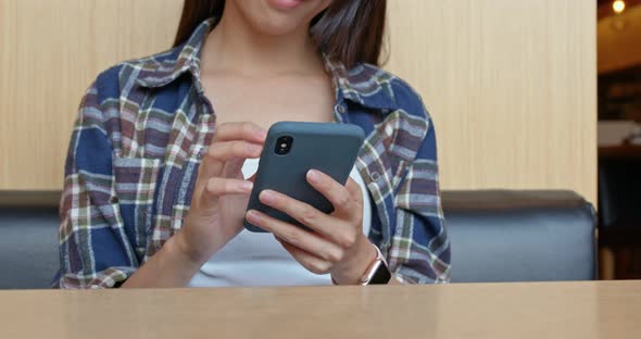 Woman use cellphone order at restaurant 