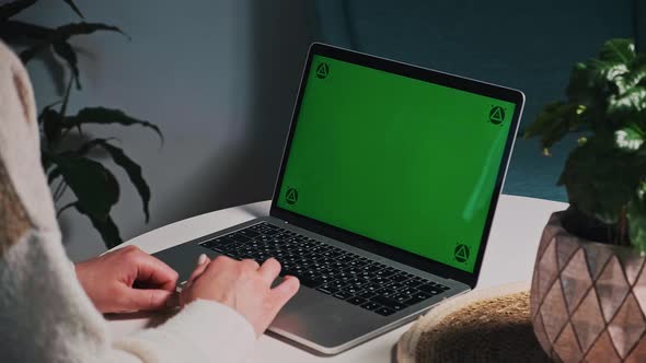 Woman Hands Using Touchpad Chroma Key Green Screen Laptop Computer on Desk at Home