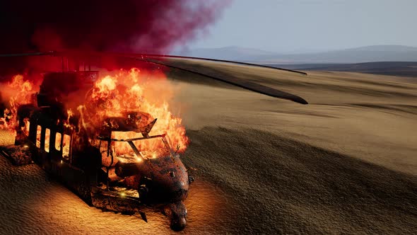 Burned Military Helicopter in the Desert at Sunset