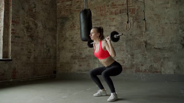 Young Woman Doing Squat Exercises