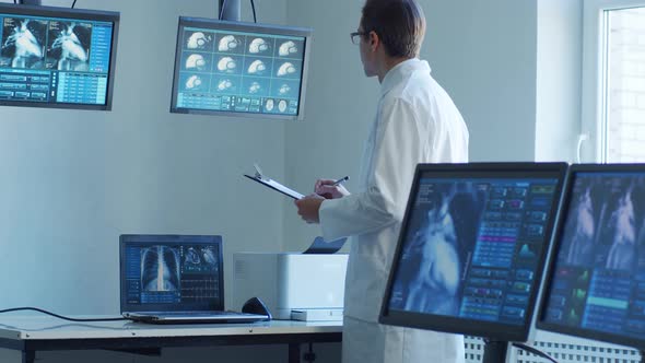 Professional medical doctors working in hospital office making computer research.