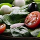 Cherry tomato falling down in fresh salad - VideoHive Item for Sale