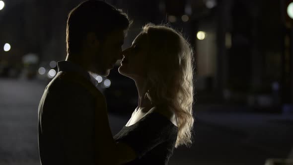 Sensual Kiss of Two Loving People, Romantic Couple Enjoying Date, Evening Time