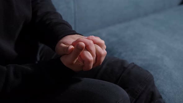 psychotherapy session: hands of stressed and nervous man talking to the psychologist