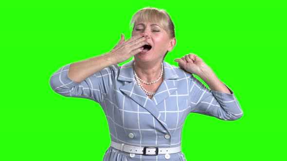 Sleepy Mature Woman on Chroma Key Background.