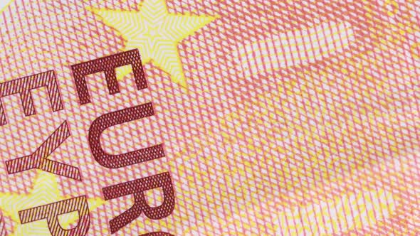 ten euro bill surface detail of printed letters rotating, macro shot. Extreme close up, very close v