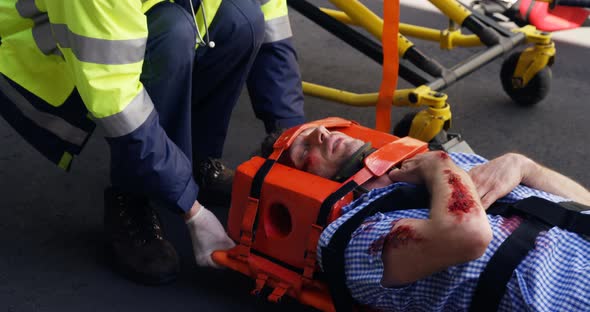 Close up of emergency medical technician holding a wounded person