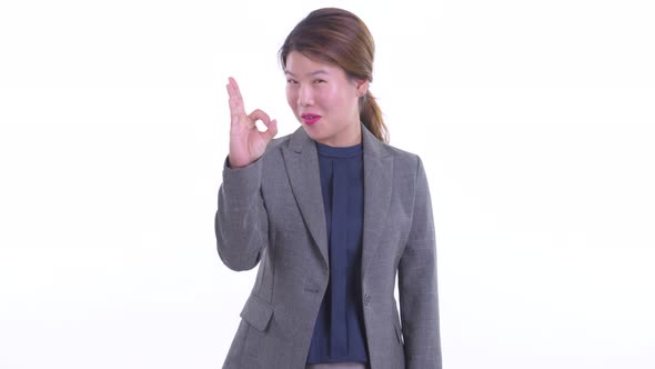 Happy Young Asian Businesswoman with Ok Sign
