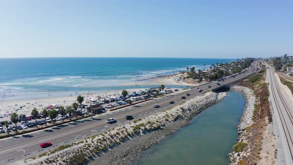 Drone shot over Cardiff-by-the-sea beach and highway 101 on the West Coast of America