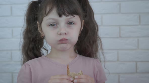 Sad child with bread alt