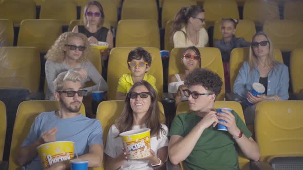 Portrait of Happy Cinema Viewers Eating Popcorn and Chatting, Group of Relaxed Carefree Men, Women