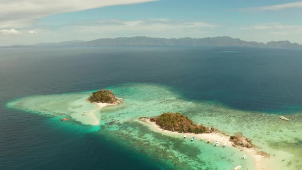 Small Torpic Island with a White Sandy Beach, Top View.