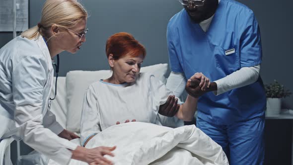 Medics Assisting Patient Getting up