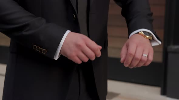 Close Up Unrecognizable Man in Suit Looking at Wrist Watch Checking Time Outdoors