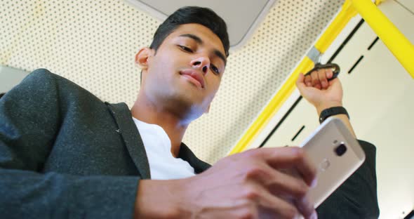 Man using mobile phone in the bus 