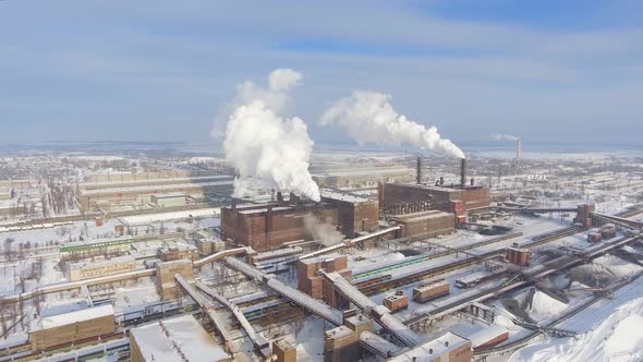 Smoking Pipes in Industrial Zone in Winter