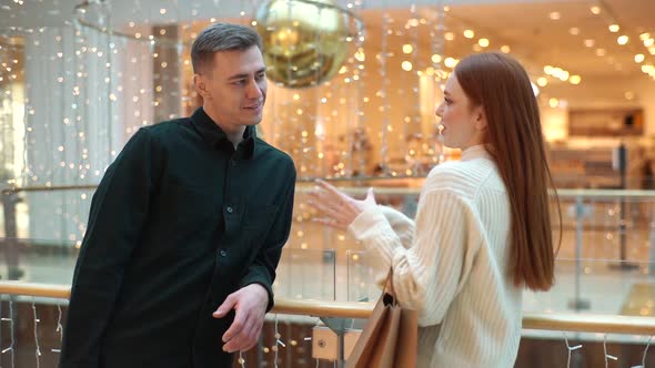 Cheerful Attractive Young Woman Telling to Handsome Man Interest Story Standing By Railing in