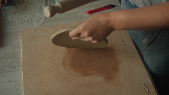 Close Up View of Female Potter Rolls Out the Clay