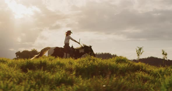 Cowgirl horseback riding