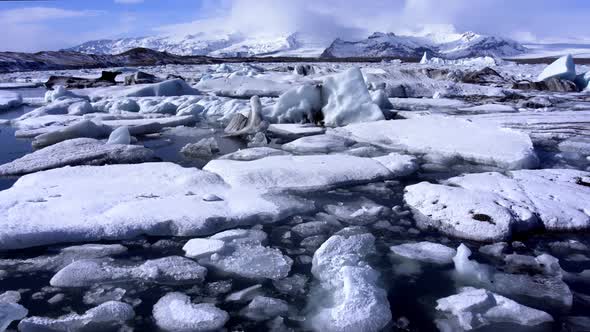 Ice From a Glacier Washing By Atlantic Ocean Waves on a Black Diamond Beach in Iceland