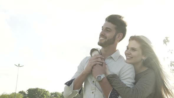 Young couple hugging in park