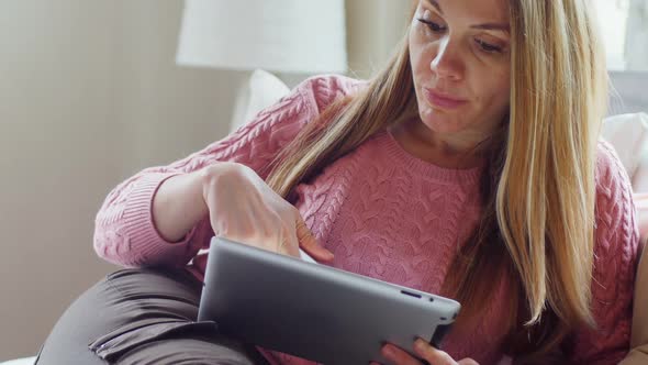 Woman using mobile phone and digital tablet