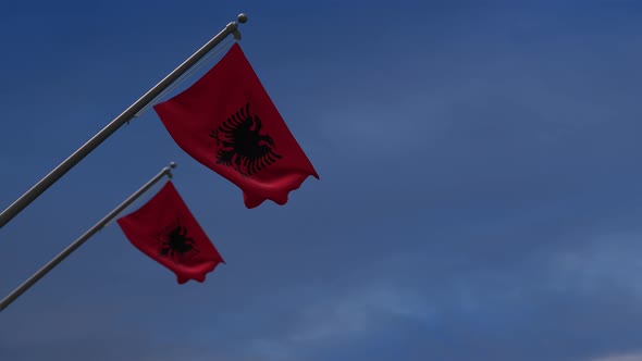 Albania Flags In The Blue Sky - 4K