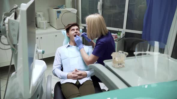 Portrait of Man Checking His Teeth