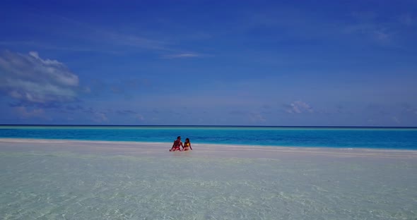 Beautiful couple married on vacation have fun on beach on paradise white sand background 4K