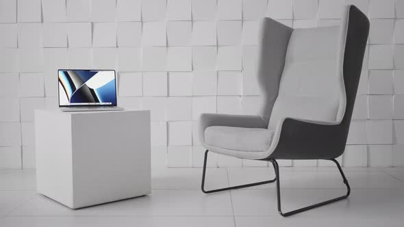 Laptop on a Cubic Shaped Coffee Table in a Modern Office