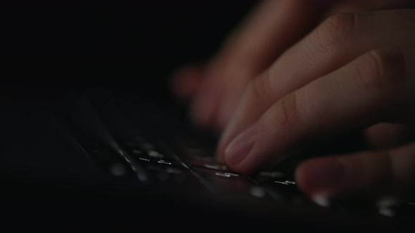 Close Up of Hacker Typing on Keyboard of Modern Laptop