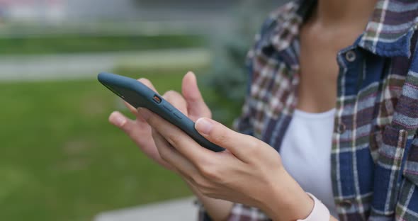 Woman use of mobile phone at outdoor